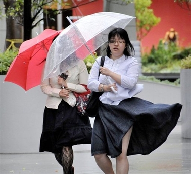 File photo shows women braving strong winds in Tokyo in late August. A powerful typhoon barrelled towards Japan on Tuesday, prompting warnings of strong winds and high waves just days after storms wreaked devastation in Southeast Asia.