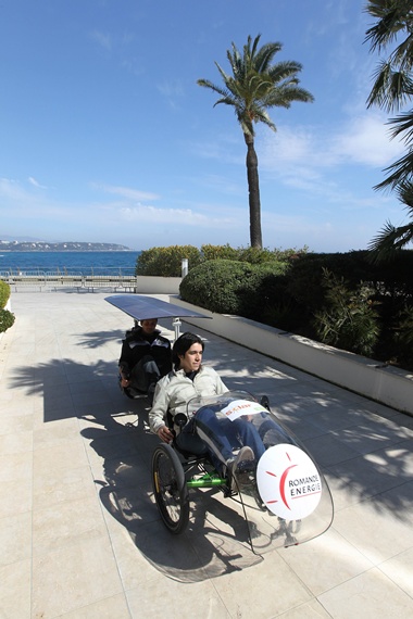 Monaco, MONACO: Men ride an electric cycle on March 22, 2012 in Monaco, on the opening day of the EVER Monaco 2012 ecological vehicles and renewable energies trade show. The event, taking place from March 22 to March 25, is organized by the environmental association of Monaco MC2D, in collaboration with National Department of the Education, Youth and Sport. AFP PHOTO/Valery Hache 