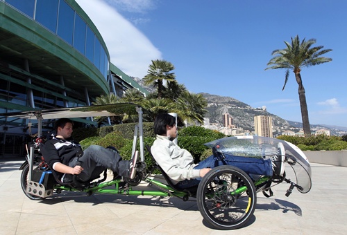 Monaco, MONACO: Men ride an electric cycle on March 22, 2012 in Monaco, on the opening day of the EVER Monaco 2012 ecological vehicles and renewable energies trade show. The event, taking place from March 22 to March 25, is organized by the environmental association of Monaco MC2D, in collaboration with National Department of the Education, Youth and Sport. AFP PHOTO/Valery Hache 