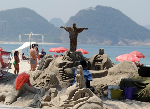 Rio de Janeiro, Rio de Janeiro, BRAZIL: A Christ the Redeemer sand sculpture is seen at Copacabana beach in Rio de Janeiro on September 19, 2012 in Brazil. Copacabana beach was included on a US website Huffington Post as one of the most dangerous beaches in the world, due to high level of crimes. AFP PHOTO/Antonio Scorza