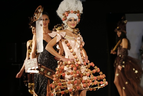 Cannes, Alpes-Maritimes, FRANCE: A model presents a dress made of chocolate and macaroons on November 22, 2012 in Cannes, Southeastern France, during a fashion show for the inauguration of Cannes international chocolate fair. The event runs until November 25, 2012. AFP PHOTO/Valery Hache