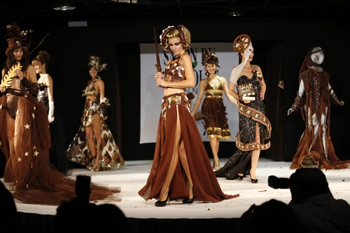 Cannes, Alpes-Maritimes, FRANCE: Models present a dress made of chocolate on November 22, 2012 in Cannes, Southeastern France, during a fashion show for the inauguration of Cannes international chocolate fair. The event runs until November 25, 2012. AFP PHOTO/Valery Hache