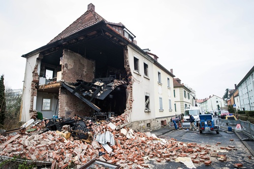 Schweinfurt, Bavaria, GERMANY: The debris of a house lies on a street in Schweinfurt, southern Germany, on February 17, 2013. Unknown reason led to an explosion that harmed a man. AFP PHOTO/David Ebener