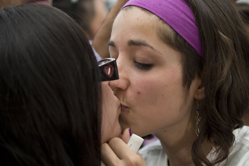 Mexico City, MEXICO: Two women kiss each other during the International Day Against Homophobia in a massive kissing protest at the bus terminal station in Mexico City on May 17, 2013, against the intimidation two homosexual women suffered from police in that station when they were kissing past May 13. AFP PHOTO/Omar Torres