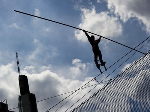 Frankfurt am Main, Hessen, GERMANY: A high-wire dancer of the acrobat group Geschwister Weisheit (wisdom siblings) performs on the tightrope on May 25, 2013 during the German Gymnastics Festival in Frankfurt am Main, western Germany. The gymnastics and sports-for-all event is running until May 25, 2013 in several venues of the Rhine-Neckar region. Organisers expect more than 80,000 participants. AFP PHOTO/Nicolas Armer 