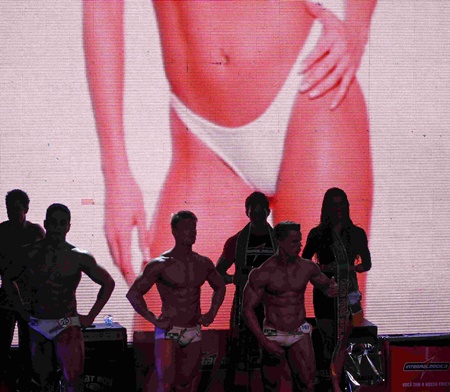 Competitors are seen during the 2013 Brazil Miss and Mister Fitness contest in Sao Paulo June 7, 2013. Some 112 men and women from all across the country competed in the event. REUTERS/Paulo Whitaker