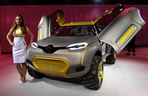 Greater Noida, INDIA: A model stands alongside the Renault concept KWLD motor-car at the Auto Expo 2014 in Greater Noida on the outskirts of New Delhi on February 5, 2014. The 12th edition of the Auto Expo takes place from February 5-11. AFP PHOTO/Sajjad Hussain