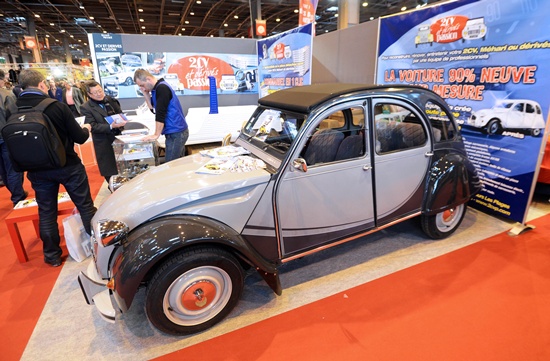 Paris, Paris, FRANCE: Visitors look at a Citroen 2CV car stand at the Retromobile vintage car expo in the Portes de Versailles exposition space in Paris, on February 5, 2014. The Retromobile vintage car expo is open to the public from February 5 to 9 and presents over 500 vintage car models. AFP PHOTO/Pierre Andrieu