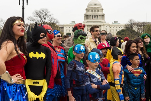 Washington, District of Columbia, UNITED STATES: People dressed in superhero-style costumes line up for a photo near the US Capitol in Washington, DC on April 18, 2014, in an attempt to break a GUINNESS WORLD RECORDS record of people as comic book charactors. They had 237 charactors show up, but needed 1532 to break the record set in China. The colorful visitors are in Washington, DC, attending the Awesome Con 2014, a celebration of all things pop culture, with a focus on comic books, science fiction, and fantasy, at the Washington Convention Center. AFP Photo/Paul J. Richards