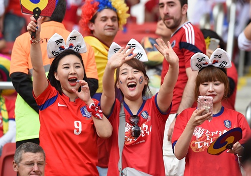 Porto Alegre, Rio Grande do Sul, BRAZIL: South Koreas fans are pictured inside the stadium before the start of a Group H match between South Korea and Algeria at the Beira-Rio Stadium in Porto Alegre during the 2014 FIFA World Cup on June 22, 2014. AFP PHOTO/Jung Yeon-Je