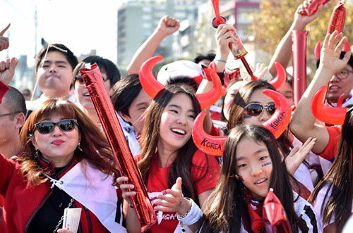 Porto Alegre, Rio Grande do Sul, BRAZIL: South Koreas fans are pictured outside the stadium before the start of a Group H match between South Korea and Algeria at the Beira-Rio Stadium in Porto Alegre during the 2014 FIFA World Cup on June 22, 2014. AFP PHOTO/Jung Yeon-Je