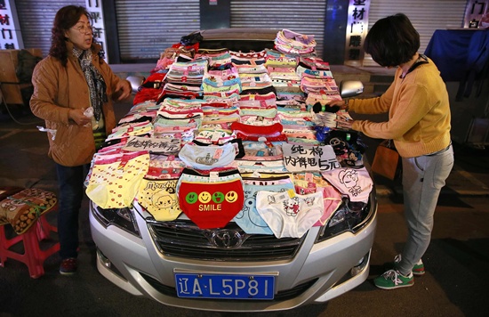 Street vendors display underwear on their car for sale as they wait for customers in Shenyang, Liaoning province October 10, 2014. Picture taken October 10, 2014. REUTERS/Stringer