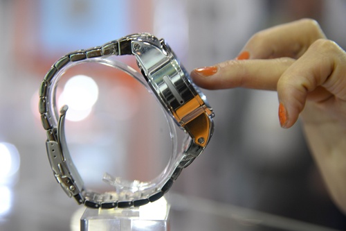Las Vegas, Nevada, UNITED STATES: The SIM card slot on a the Dutch-designed Burg smartwatch is seen on the left side of the watch, at the Consumer Electronics Show in Las Vegas Nevada January 7, 2015. The 3G touchscreen Burg smart watch combines fashion with functionality, allowing users to make and receive calls without being linked to a smart phone, and features a built-in SIM-card slot, video camera, micro SD card slot, Bluetooth and GPS. AFP PHOTO/ROBYN BECK