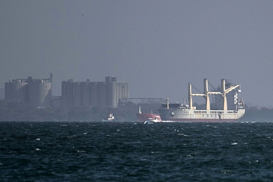 Cartagena, COLOMBIA: (FILES) In this file picture taken on March 3, 2015, a Chinese freighter, Hong Kong-registered Da Dan Xia, which was heading for Cuba, is seen anchored at the port of Cartagena, Colombia, after it was found to be loaded with undeclared military equipment including about 100 tonnes of gunpowder, 99 projectile bases and 3,000 artillery cartridge cases, according to Colombian authorities. A judge has ordered house arrest for the Chinese captain of a freighter Colombia stopped in port for carrying unregistered Cuba-bound weapons and materiel, a prosecutor said on March 8. AFP PHOTO/Files/JOoaquin Sarmiento