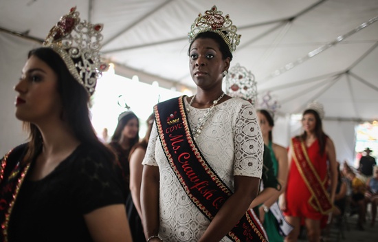 Belle Chasse, Louisiana, UNITED STATES: Visiting pageant queens from other Louisiana towns watch the Plaquemines Parish Seafood Festival Queen pageant on May 16, 2015 in Belle Chasse, Louisiana. Mario Tama/Getty Images