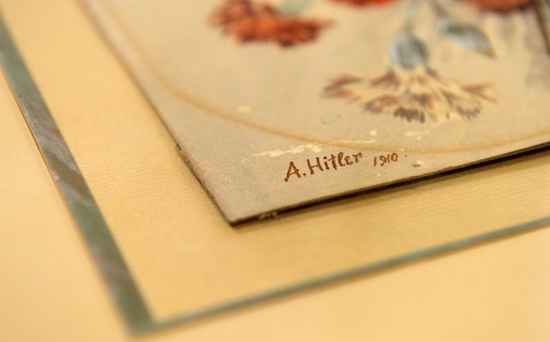 Nuremberg, Bavaria, GERMANY: (FILES) The signature reading A Hitler, 1910 at the watercolour Nelkenstrauss (carnation bouquet) is pictured, on June 11, 2015 in the Weidler auction house in Nuremberg, southern Germany. AFP PHOTO/Christof Stache