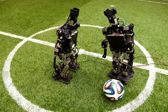 Bordeaux, Gironde, FRANCE: Robots play football at the LABRI Laboratory (computer science research center) in Bordeaux on July 3, 2015. AFP PHOTO/Jean Pierre Muller