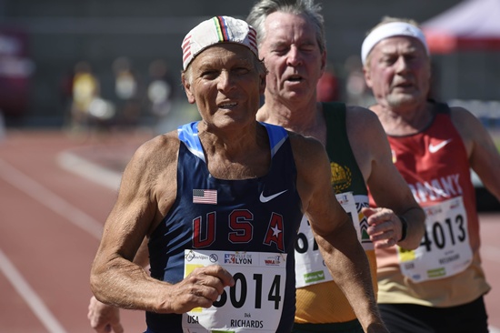 Lyon, Rhone, FRANCE: US Dick Richards (L), South Africas Ronald Cross (C) and Germanys Karl-Heinz Neumann (R) compete in the mens 100m final for 80 years old, during the World Masters Athletics Championships on August 7, 2015 in Lyon, southeastern France. AFP PHOTO/Philippe Desmazes