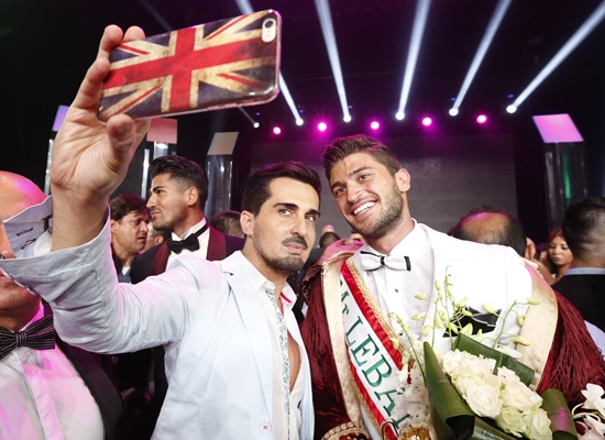 Jounieh, LEBANON: Farid Matar (R) poses for a picture after winning the Mr. Lebanon title during the beauty contest at Casino du Liban in Jounieh, north of the Lebanese capital Beirut, on September 4, 2015. AFP PHOTO/Anwar Amro