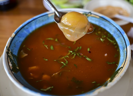 JUCHITAN, Oaxaca, MEXICO: A soup Golfina turtle (Lepidochelys olivacea) egg-soup is pictured in a restaurant in Juchitan, Oaxaca State, Mexico, on September 10, 2015. Members of the Federal Environmental Attorney (Profepa) protect the Golfina turtles (Lepidochelys olivacea) from egg-thieves when they arrive to spawn, surveying the beach with a drone. Massive arrivals of sea turtles, known as Arribadas, happen in Morro Ayuta Beach, when thousands of turtles arrive to lay their eggs. AFP PHOTO/Ronaldo Schemidt