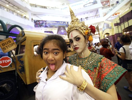 A Thai student poses for a picture at a Halloween event at a shopping mall in Bangkok, Thailand, Friday, Oct. 30, 2015. (AP Photo/Sakchai Lalit)