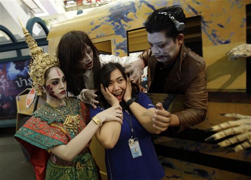 A Thai woman poses for a picture at a Halloween event at a shopping mall in Bangkok, Thailand, Friday, Oct. 30, 2015. (AP Photo/Sakchai Lalit)