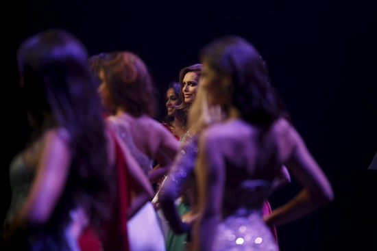 Angela Ponce, 24, (2nd R) competes in the Miss World Spain pageant in Estepona, southern Spain, October 25, 2015. Ponce, the first openly transsexual woman to compete to represent Spain at the Miss World pageant, was eliminated in the first knockout round. But Ponce already feels like a winner, she said, because her participation has brought visibility for the transgender community. We need to educate society for diversity, Ponce said. Picture taken October 25, 2015. REUTERS/Susana Vera