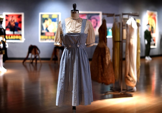 New York, New York, UNITED STATES: A Judy Garland-worn Dorothy dress from The Wizard of Oz is displayed during a press preview on November 19, 2015 in New York, as Bonhams And Turner Classic Movies (TCM) Present Treasures from the Dream Factory auction to take place November 23 in New York. AFP PHOTO/Timothy A. Clary