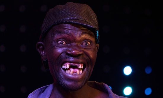 Harare, ZIMBABWE Newly crowned Mr Ugly Zimbabwe, Mison Sere, poses during the Ugliest Man contest in Harare, Zimbabwe, on November 20, 2015. AFP PHOTOJekesai Njikizana