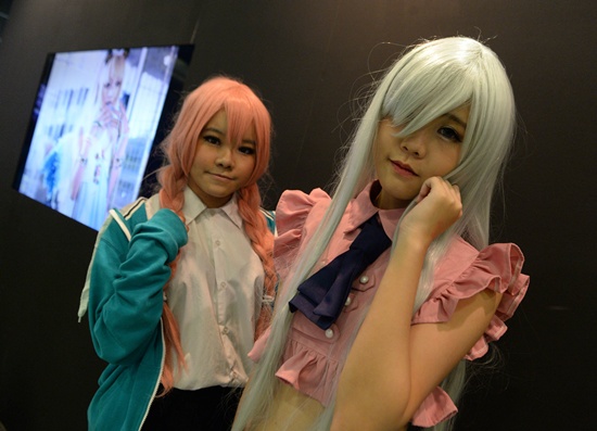 Singapore, SINGAPORE: Cosplay fans dressed in costume attend the Anime Festival Asia 2015 in Singapore on November 27, 2015. AFP PHOTO/Roslan Rahman