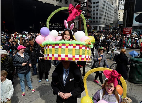 New York, State of New York: People on Fifth Avenue during the annual Easter Parade and Easter Bonnet Festival March 27, 2016. AFP/Timothy A. Clary