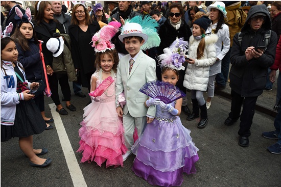 New York, State of New York: Children wear their Easter finery as they walk down Fifth Avenue in New York during the annual Easter Parade and Easter Bonnet Festival March 27, 2016. AFP/Timothy A. Clary 