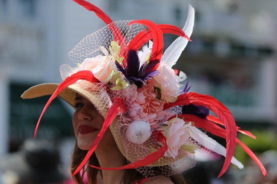 Louisville, Kentucky, UNITED STATES: A woman wearing a festive hat looks on prior to the 142nd running of the Kentucky Oaks at Churchill Downs on May 06, 2016 in Louisville, Kentucky. Michael Reaves/Getty Images/AFP