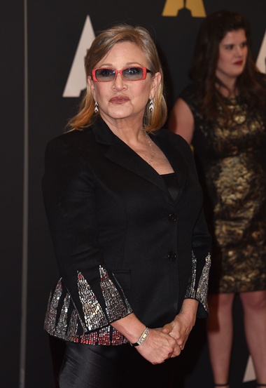 Hollywood, California, UNITED STATES: (FILES) This file photo taken on November 15, 2015 actress Carrie Fisher at the 7th Annual Governors Awards in Hollywood, California. After decades of fast living that her fearless Star Wars character Princess Leia would have struggled to keep up with, Carrie Fisher knows a thing or two about life. Now she wants to share her experiences, and perhaps impart a pearl of wisdom or two, in her latest role -- as an agony aunt for a British newspaper. AFP/Valerie Macon/XGTY 