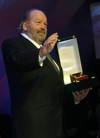 Cairo: (FILES) This file photo taken on November 30, 2004 shows US comedian Bud Spencer receiving a life achievement award at the opening night of Cairos 28th International Film Festival at the Opera House in Cairo. Italian actor Bud Spencer, who starred in a string of spaghetti westerns, died on Monday in Rome aged 86, his family announced. AFP/Amro Maraghi