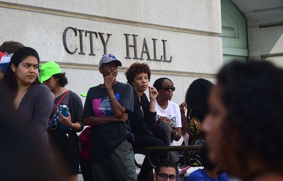Los Angeles, California: Black Lives Matter activists and their supporters protest on the steps of Los Angeles City Hall on July 12, 2016 in Los Angeles, California, following a Police Commission ruling that officers acted within department policy in the killings of two southern California civilians over the past year. AFP/Frederic J. Brown