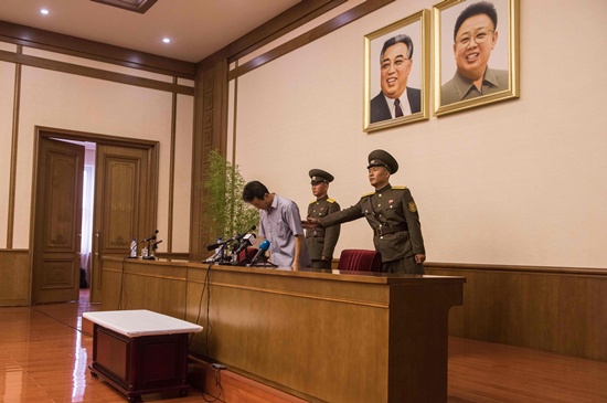 Pyongyang: Ko Hyon-Chol (L) bows as he is escorted to a press conference at the Peoples Palace of Culture in Pyongyang on July 15, 2016. North Korea on July 15 paraded a defector accused of involvement in a child abduction plot masterminded by South Korean agents. AFP/Ed Jones
