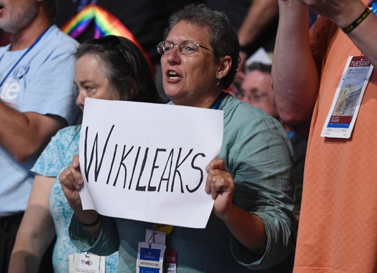 Philadelphia, Pennsylvania: A woman holds up a sign referencing Wikileaks during Day 2 of the Democratic National Convention at the Wells Fargo Center in Philadelphia, Pennsylvania, July 26, 2016. AFP/Saul Loeb