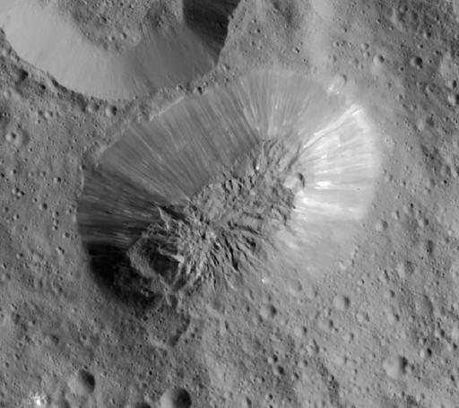 This image provided by NASA, shows an inactive volcano on the surface of Ceres, the largest object in the asteroid belt between Mars and Jupiter. (NASA/JPL-Caltech/UCLA/MPS/DLR/IDA via AP)