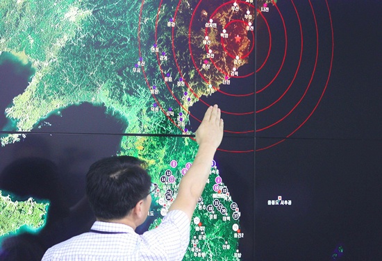 Seoul: A South Korean official points to a map showing the epicenter seismic waves in North Korea, at the Korea Meteorological Administration in Seoul on September 9, 2016 following news of another nuclear test by North Korea. North Korea has conducted a fifth nuclear test, its most powerful to date, South Koreas President Park Geun-Hye said on September 9, condemning the move as an act of self-destruction that would deepen its isolation. AFP/Yonhap 
