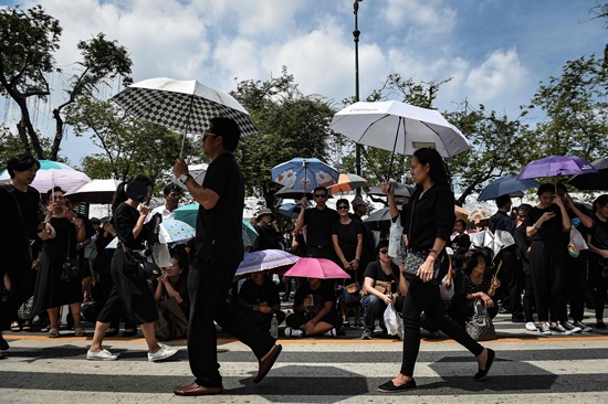 Bangkok: Thousands of mourners clad in black gather on the streets near the Grand Palace to pay respects to the late Thai King Bhumibol Adulyadej in Bangkok on October 22, 2016. Thailands King Bhumibol Adulyadej died at the age of 88 on October 13 after years of ill health, ending a seven-decade reign and leaving the politically divided nation without its key pillar of unity. AFP/Lillian Suwanrumpha