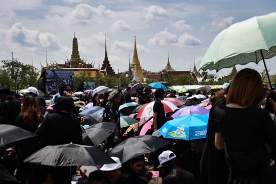 Bangkok: Thousands of mourners clad in black gather in front of the Grand Palace to pay respects to the late Thai King Bhumibol Adulyadej in Bangkok on October 22, 2016. Thailands King Bhumibol Adulyadej died at the age of 88 on October 13 after years of ill health, ending a seven-decade reign and leaving the politically divided nation without its key pillar of unity. AFP/Lillian Suwanrumpha