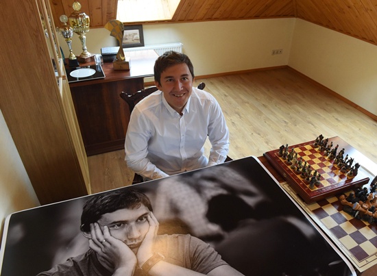 Moscow: A picture taken on September 19, 2016 shows Russian grandmaster Sergei Karyakin looking on during an interview with AFP at his home outside Moscow. Sitting next to an ornate chess board in his home outside Moscow, Russian grandmaster Sergei Karyakin lowers his gaze as he ponders how to beat reigning world champion Magnus Carlsen. Next month Karyakin, 26, will have his stab at dethroning Carlsen, 25, in New York as he takes on the Norwegian phenomenon in a 600,000-euro ($668,000) match up some are hyping as a clash between East and West that echoes the Cold War. AFP/Vasily Maximov