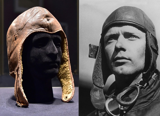Paris: (COMBO) This combination of pictures created on November 15, 2016 shows the flying hat of aviation pioneer Charles Lindbergh (L) displayed on November 15, 2016 at the Hotel Drouot auction house in Paris, on the eve of its sell and an undated file portrait of US aviator Charles Lindbergh (R). AFP/Christophe Archambault and Stringer