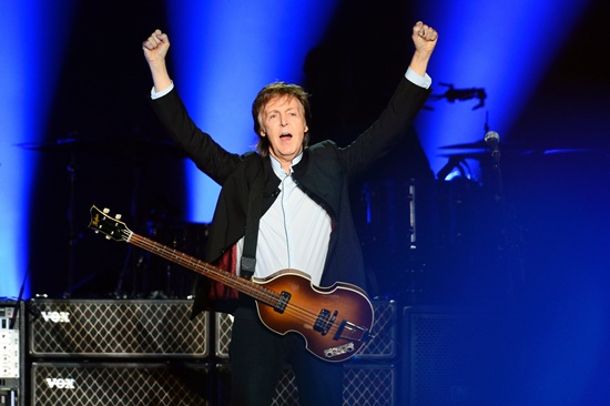Paris: (FILES) This file photo taken on May 30, 2016 shows British musician and former Beatles member Paul McCartney performing on stage at the Bercy stadium in Paris. Paul McCartney on January 18, 2017 filed a lawsuit to secure the copyright to the Beatles back catalog in a case that could have wide ramifications for the music industry. AFP/Bertrand Guay
