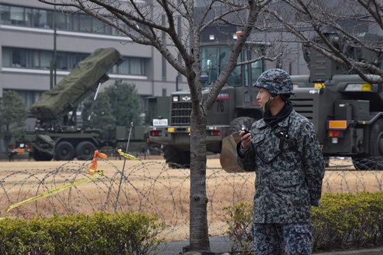 Tokyo: A Japan Self-Defense Forces soldier stands guard near a PAC-3 surface-to-air missile launcher unit (C), used to engage incoming ballistic missile threats, in position at the Defence Ministry in Tokyo on March 6, 2017. AFP/Kazuhiro Nogi