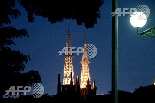 This picture taken on April 9, 2017 shows the St. Mary of the Assumption Cathedral lighting up in Jakarta ahead of the Christian festival of Easter. The Cathedral is also the seat of the Roman Catholic Archbishop of Jakarta. Goh Chai Hin/AFP