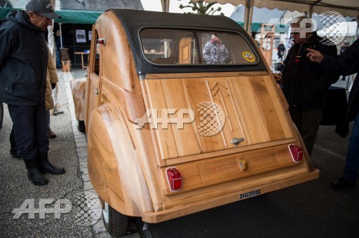 This photo taken on March 21, 2017 shows a handbuilt wooden 2CV Citroen Car built as an exact one/one replica, near Loches, Central France. Guillaume Souvant/AFP