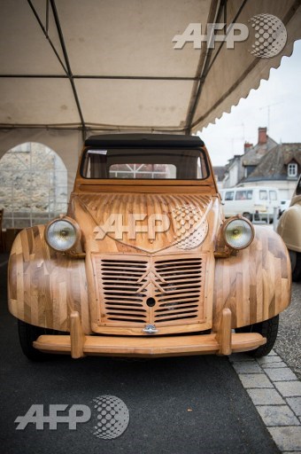 This photo taken on March 21, 2017 shows a handbuilt wooden 2CV Citroen Car built as an exact one/one replica, near Loches, Central France. Guillaume Souvant/AFP