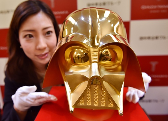 Tokyo: An employee of Japans jeweler Tanaka Kikinzoku Jewelry displays a pure gold life size mask of Darth Vader, a character in the Star Wars, at their main shop in Ginza shopping district in Tokyo on April 25, 2017. AFP/Kazuhiro Nogi